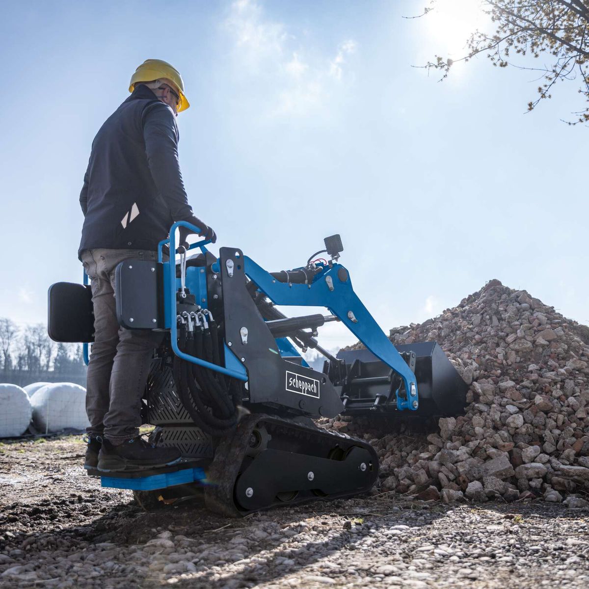 Scheppach hydraulic loader with operator cabin for material handling and transport