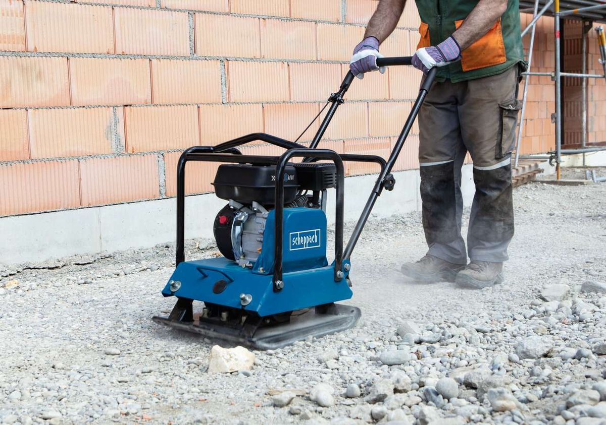 Scheppach vibrating plate compactor with engine and base plate in use