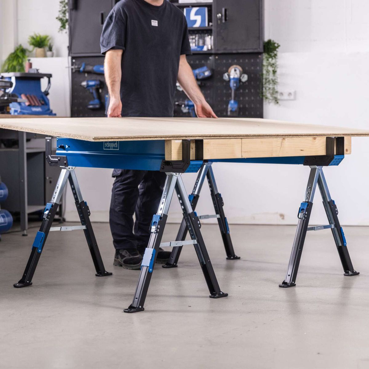 Scheppach workbench setup with adjustable height supports and sturdy legs for precise woodworking