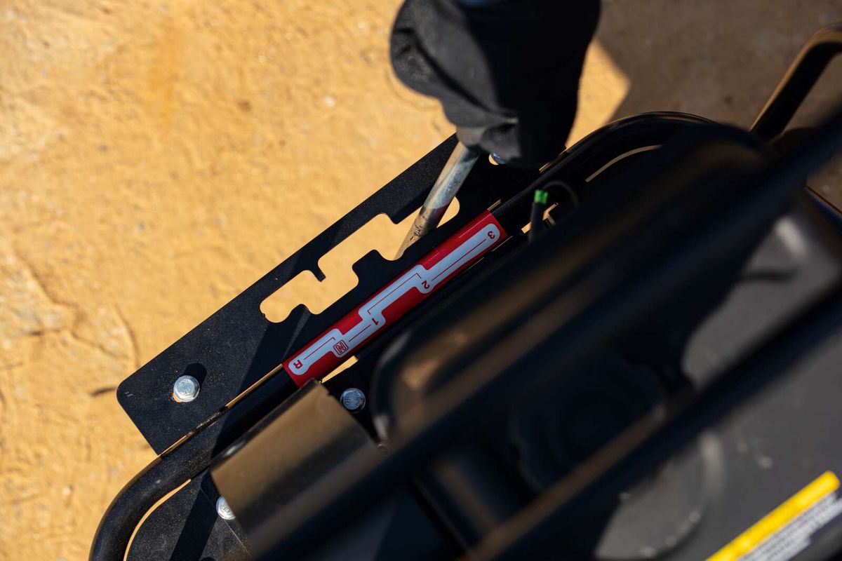 Close-up of a Scheppach dumper component with bolted connection and mounting bracket
