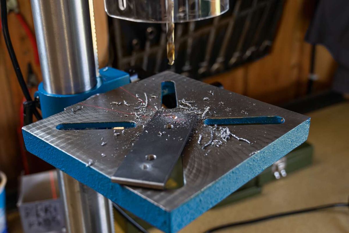 Scheppach bench pillar drill in operation with chuck and workpiece holder