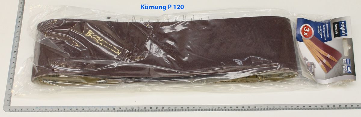 Scheppach grinding belt (abrasive grade P 120) in packaging with scale