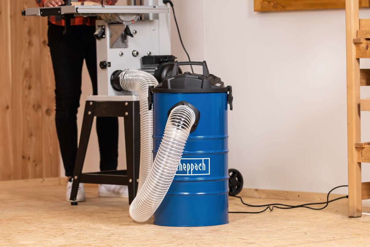 Scheppach dust extractor with hose and container in use