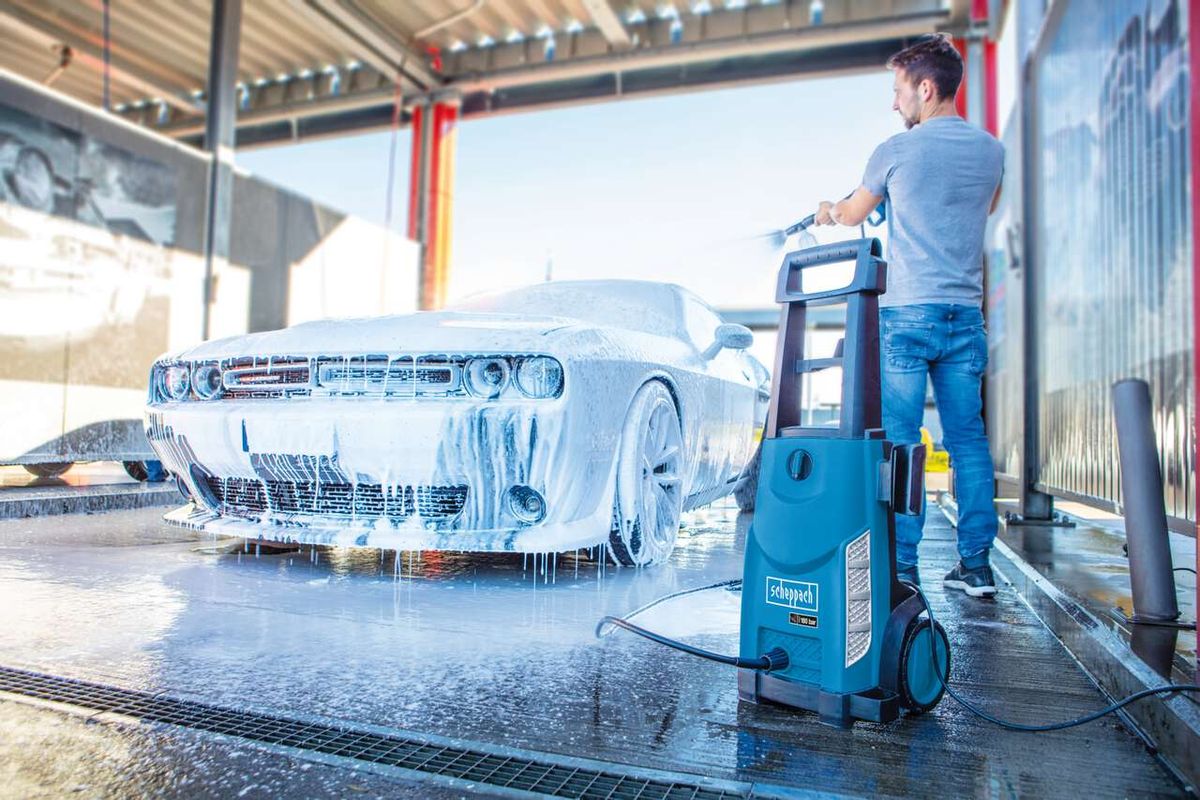 Scheppach pressure washer in use at car wash with vehicle visible
