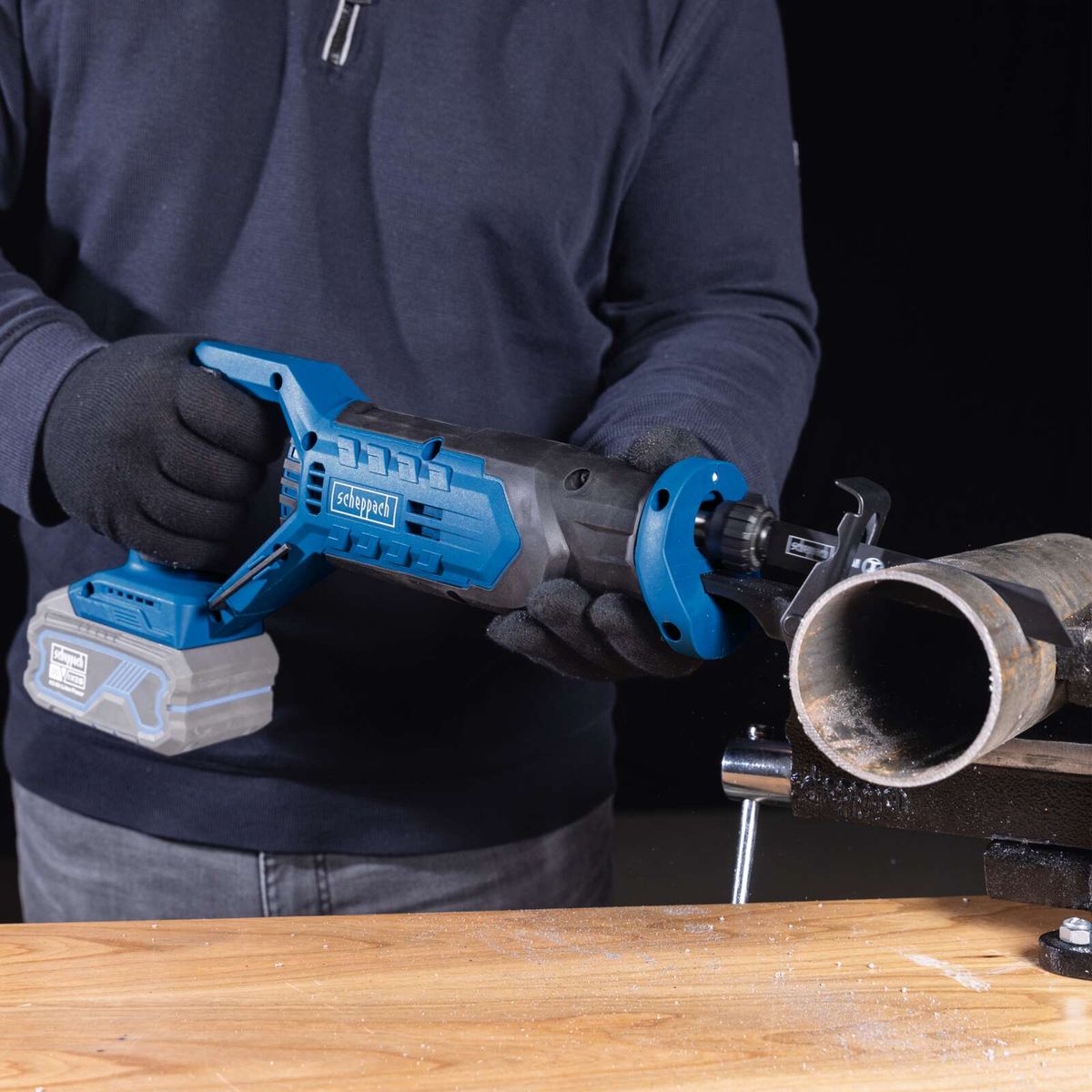 Reciprocating saw with attachment for cutting precision during operation