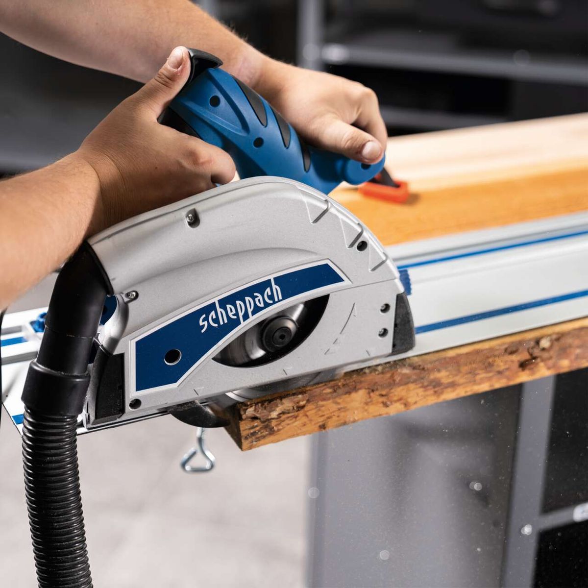 Scheppach plunge saw with guide rail and 24-inch blade in use