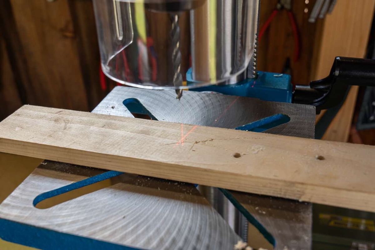 Bench pillar drill with laser guide and adjustable speed for accurate drilling