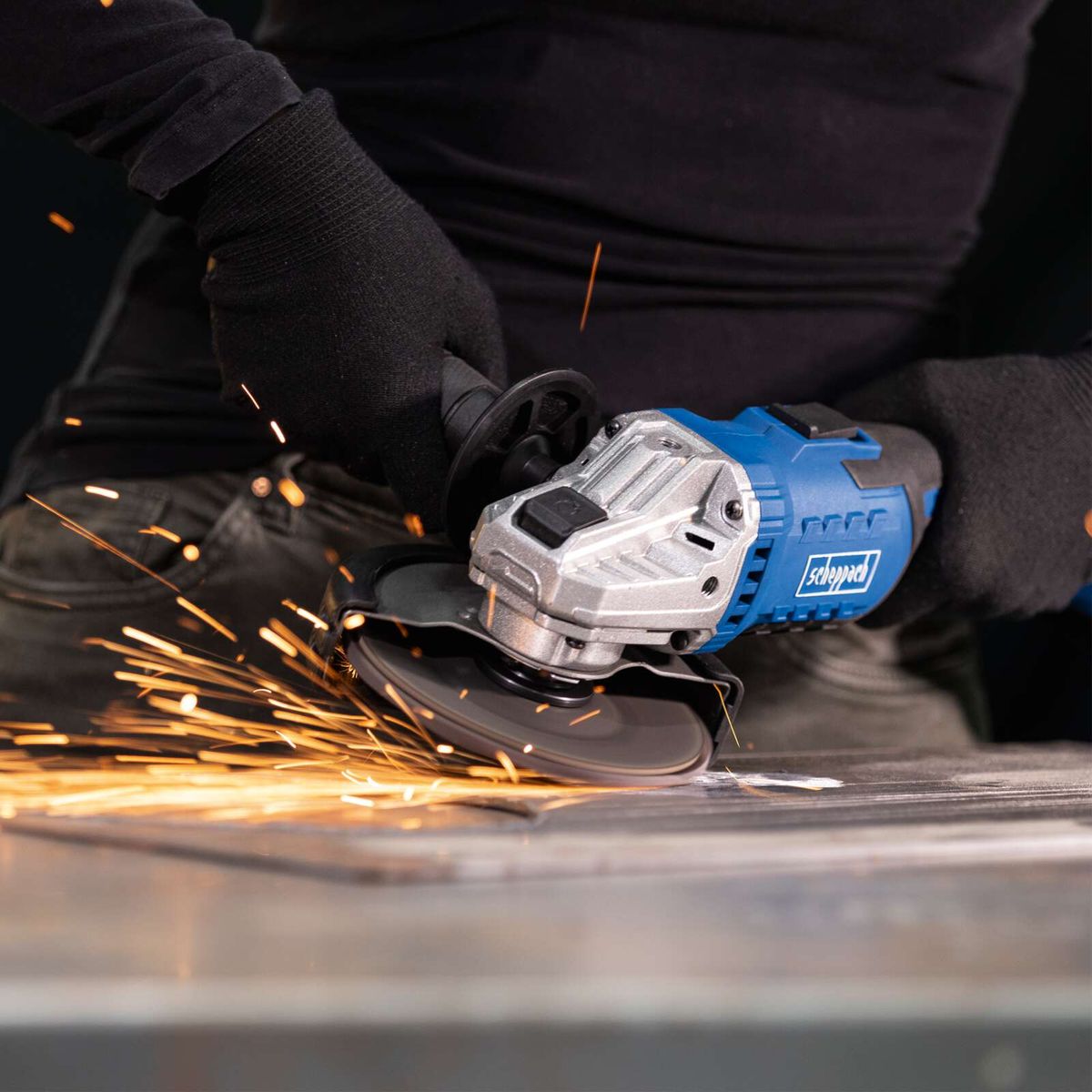 Scheppach cordless angle grinder with grinding action, sparks visible during operation