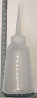 250 ml oil bottle with applicator, measuring scale included