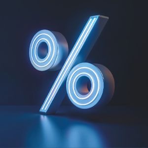 A 3D rendering of a percentage symbol in white and blue. The symbol is slightly tilted and has a glossy surface.