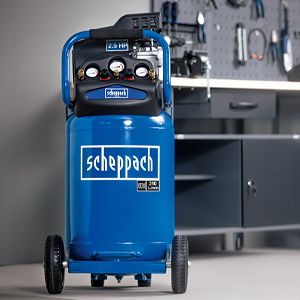 Scheppach air compressor in a workshop setting. The unit features a 24-litre tank and a pressure of 8 bar.